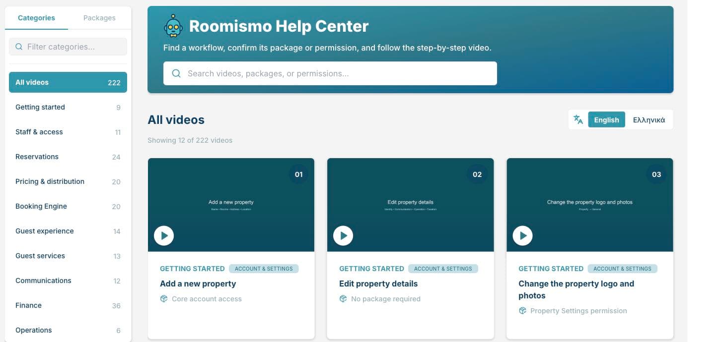 Roomismo Help Center showing the searchable video library and English and Greek language options